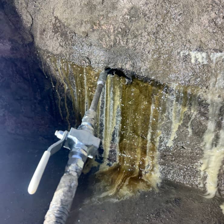 Polyurethane injection sealing basement wall crack to stop water leaks